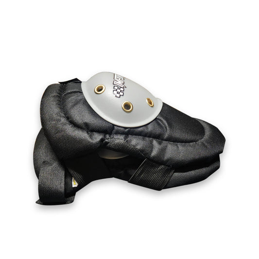 Black protective knee pad with a white and gold label on a white background