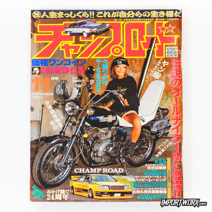 Champ Road November 2011 front cover featuring motorcyclist and Toyota Crown sedan.