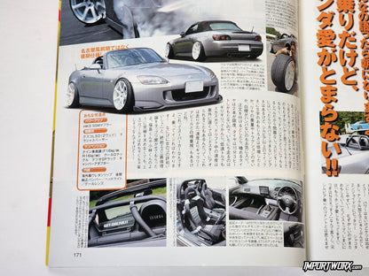 Silver Honda S2000 lowered with white aftermarket wheels.