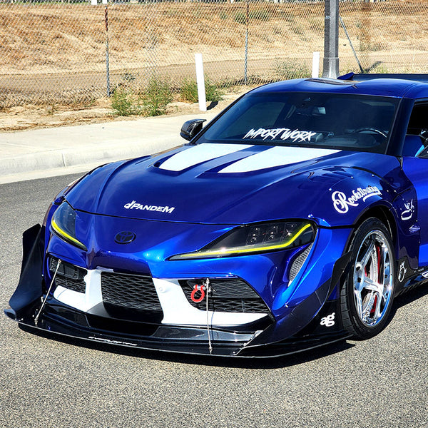 Blue sports car with visible branding on a road