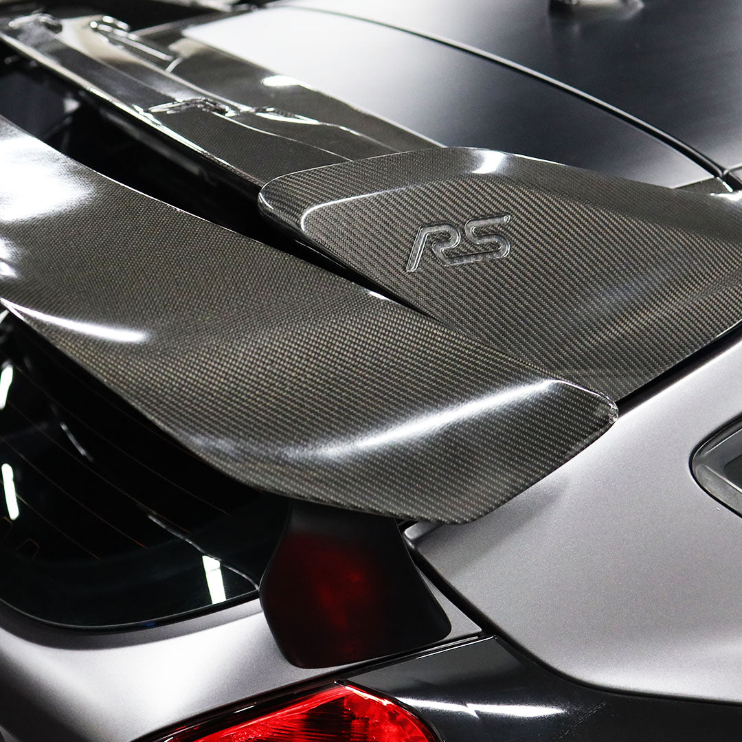 Car spoiler with 'RS' logo on a vehicle